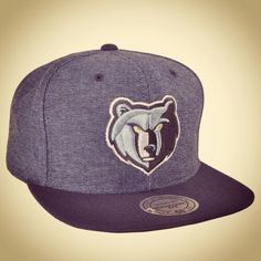 the grizzle bears snap back hat is shown in grey and black, with an embroidered grizzle bear on the front