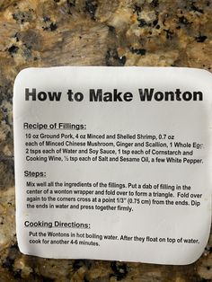 a sign describing how to make wontons on a granite counter top with instructions