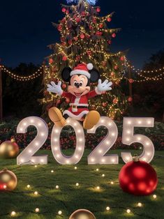 mickey mouse in front of a christmas tree with lights and decorations on it's lawn