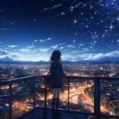 a woman standing on top of a balcony looking at the stars in the night sky