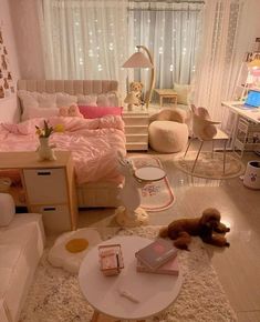 a bedroom with white furniture and pink bedding