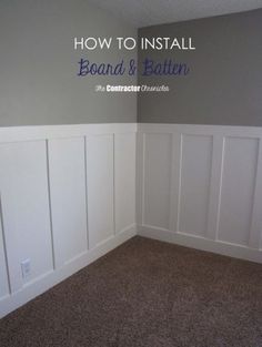 an empty room with white paneling and brown carpet