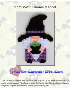 an image of a cross stitch pattern for a gnome with a black hat and green eyes