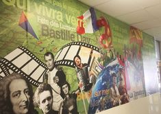 a wall with some pictures on it and people in the movie scene painted on it