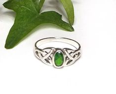 "My Celtic Emerald Green CZ Gemstone ring was created in solid Sterling Silver. The front of the ring is set with an oval faceted Emerald green cubic zirconia cab and is framed with a Celtic Trinity knot on each side of the stone. The face of the ring measures 8mm or .31 inches. Please select your size from the drop down menu. ~The color in this ring is a true Celtic or Irish green and is the birthstone for May. ~The Celtic Trinity or Triquetra symbolizes the \"Trine\" or the \"Three\". It consi Classic Adjustable Green Emerald Ring, Green Opal Promise Ring, Green Birthstone Ring For Promise, Emerald Green Ring, Trinity Ring, Celtic Trinity Knot, Green Ring, Green Rings, Trinity Knot