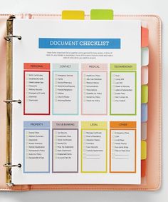 a pink binder with a document checklist on it