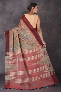 Flaunt ethnic look on festive occasions in this elegant dusy pink hand painted Kalamkari Gicha silk saree. The saree has a contrasting maroon border. It comes with a matching blouse piece. Shop silk arees in USA from Pure Elegance. Disclaimer: The shown stitched blouse on the model is for display purpose only. The saree comes with a matching blouse piece and finished with fall and piko. Kalamkari Print Slub Silk Pre-draped Saree, Red Katan Silk Saree With Kalamkari Print, Red Chanderi Saree With Kalamkari Print, Red Silk Saree With Kalamkari Print, Red Raw Silk Traditional Wear With Kalamkari Print, Brown Tussar Silk Saree With Cutdana, Red Tussar Silk Traditional Wear With Kalamkari Print, Red Kalamkari Print Pre-draped Saree, Traditional Brown Tussar Silk Saree