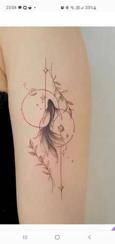 a woman's thigh with a tattoo design on the back of her leg and an arrow