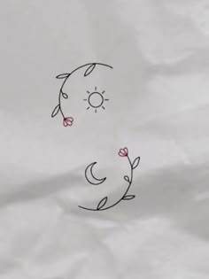 an image of a drawing on paper with flowers in the middle and sun above it