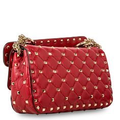 Steal the show with the on-trend (and soon to be classic) from Valentino. The Rockstud Spike bag is crafted out of beautifully soft lambskin and amplified by the simplistic rhombus stitching pattern, the bold and darish deep red hue is offset perfectly by the glossy-gold finish on the iconic rockstuds we all adore Valentino for. Wear this bag over the shoulder using the ultra-cool chain shoulder strap or simply remove to use the spike bag as your perfect date on your night out! SPL Exterior Red Spike Bag, Perfect Date, Engraved Logo, Exclusive Bag, Deep Red, Chain Strap, Gold Finish, Exclusive Designs, Red Leather