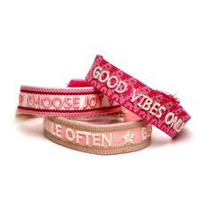 "FEATURES --Sold as a set of 3 --Embroidered front signature --Pink, Hot Pink, White and Beige cotton --Slide fastening with tassels; bracelets adjustable for wrists 6\" - 7.5\" PHRASES: Good Vibes Only Choose Joy Smile Often * Be Kind The grown-up version of friendship bracelets We are SO HERE FOR THESE. In case you've forgotten, a friendship bracelet is given as a symbol friendship. We've chosen 3 phrases to celebrate friendship and positivity that we know you'll love as much as we do. This se Woven Friendship Bracelets, Embroidered Bracelet, Bracelets Adjustable, White And Beige, I Love Ny, Choose Joy, Boho Bracelet, Mom And Sister, Unisex Jewelry