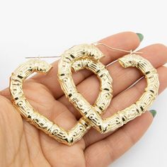 "2\" Heart Bamboo Hoop Earrings Real 10K Yellow Gold *Metal : Real 10K Gold (Properly Stamped, 10K) *Condition : Brand New *Finish : Polished *Weight : 10.09 grams *Length : 2\" = 54mm *Width : 3/16\" = 5mm *Clasp/Bail : Snap Bar All of our items are brand new and are shipped with a gift box." Gold Hoop Earrings With Heart Charm, Heart-shaped Pierced Hoop Earrings For Anniversary, Anniversary Heart Charm Hoop Earrings, Anniversary Hoop Earrings With Heart Charm, Yellow Gold Hoop Earrings For Valentine's Day, Valentine's Day Anniversary Metal Hoop Earrings, Gold Metal Hoop Earrings For Valentine's Day, Pierced Hoop Heart Earrings For Anniversary, Metal Hoop Heart Earrings For Anniversary