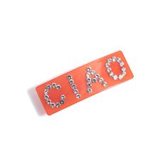 Elevate your everyday look with the Ciao Barrette in vibrant coral. This chic accessory, measuring 3" in length and 1" in width, is a delightful blend of glass and alloy. Brought to you by Shiraleah, a brand renowned for creating lifestyle products that add a special touch to your life. Whether you're running errands or attending a special event, this barrette adds a pop of color and sparkle to your hair. It's the perfect way to keep your locks in place while showing off your personal style. Del Trendy Coral Jewelry For Summer, Trendy Coral Summer Jewelry, Chic Red Summer Jewelry, Chic Glass Jewelry As Gift, Elegant Orange Glass Jewelry, Trendy Red Glass Jewelry, Icon Shoes, Boot Jewelry, Lifestyle Products