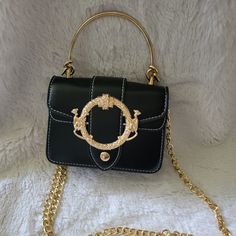 Never Used Mini Bag. Black With Gold Detail And Gold Adjustable Chain Strap Black Party Bag With Hardware Details, Black Party Bag With Hardware, Evening Satchel Bag With Hardware Details, Evening Satchel Bag With Hardware, Luxury Black Shoulder Bag With Hardware, Elegant Crossbody Shoulder Bag With Hardware, Black Evening Bag With Hardware, Black Evening Bags With Hardware Details, Chic Black Bag With Hardware Details