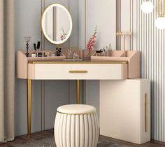 a vanity with a mirror, stool and other items on the table in front of it