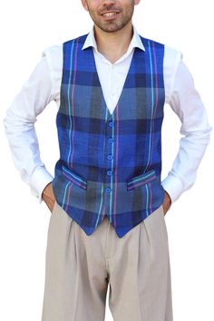 Men's printed linen waistcoat, Blue plaid casual vest, Men's Argentine Tango gilet, Milonga men's Tuxedo vest, Latin practice men's vest Blue Checkered Linen Tango Vest A classic design crafted from linen ideal for argentine tango dancers. It features a button fastening, two decorative front pockets and a back strap for an adjustable fit. The back is made from matching color lining fabric.  Pair it with Linen Tango Pants : https://www.etsy.com/listing/1553318322/mens-tango-performance-trousers-m Fitted Blue Sweater Vest For Summer, Blue Sweater Vest For Summer, Blue Fitted Sweater Vest For Summer, Fitted Plaid Cotton Vest, Fitted Plaid Sleeveless Vest, Fitted Sleeveless Plaid Vest, Tango Pants, Linen Waistcoat, Men's Tuxedo