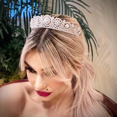 Delicate bridal crown for a soft and elegant wedding day look. Encrusted with Swarovski crystals and cubic zirconium for endless glitter. -Genuine Crystal -AAA Cubic Zirconia -Comb added for comfort and security -Approx. 1.5 in (3.8 cm) wide x 10 in. (25.4 cm) long -Rhodium Plated. Brilliant non tarnish silver finish Silver Princess Crown With Pinched Shape, Glamorous Rhinestone Wedding Headpiece, Glamorous Wedding Headpiece With Rhinestones, Glamorous Rhinestone Headpiece For Wedding, Elegant Crystal Headpieces For Weddings, Wedding Headpiece With Rhinestones And Round Crown, Elegant Teardrop Crown Wedding Headpiece, Elegant Silver Crown For Wedding, Wedding Jewelry With High Crown And Crown Design