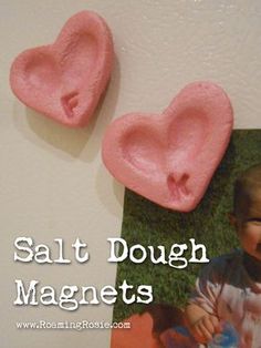 two heart shaped doughnuts sitting on top of a table