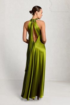 Timeless minimalism at it's best is the Isla Gown. This relaxed fit high neck full length halter gown fixes at the back neckline with delicate gold buttons. The gown has a gentle fit & flare silhouette in a luxurious weighted high quality satin with a low V back. Worn with a sleek sash at the back neckline with lon Green Satin Maxi Dress, Dress Shields, Bridesmaids Outfits, Cosy Outfit, Bridal Separates, Halter Gown, Sash Belts, Sash Belt