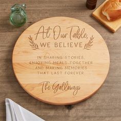 a wooden plaque that says at our table we believe in sharing stories, enjoying meals together and making memories that last forever