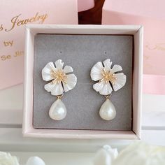 * DETAILS * - Teardrop shaped Freshwater White Pearls  - White Flower Gold Plated Post Earrings  🌟More earrings. https://www.etsy.com/JinnysJewelryBySeJin/listing/1100504878/freshwater-pearl-dangle-earrings-pearl?utm_source=Copy&utm_medium=ListingManager&utm_campaign=Share&utm_term=so.lmsm&share_time=1636052013167 🎁A designer pull drawer pink gift box is available when the gift wrapping option is chosen. -------------------------------------------------- * CARE TIPS * ⭐️TO PREVENT TARNISH: Kee White Teardrop Flower Earrings, White Teardrop Flower Earrings With Pearl Drop, White Teardrop Dangle Earrings For Anniversary, White Teardrop Bridal Earrings For Pierced Ears, White Teardrop Clip-on Earrings For Gifts, White Pearl Drop Clip-on Earrings For Gift, White Drop Earrings Gift, White Drop Earrings For Gift, White Teardrop Flower Earrings For Anniversary