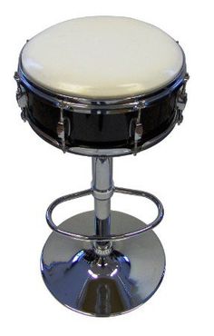 a black and white stool with chrome legs on a white background in the shape of a drum