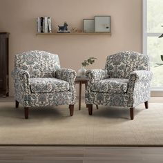 two chairs sitting next to each other in a living room