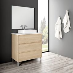 a bathroom with two white towels hanging on the wall next to a sink and mirror