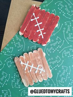 two popsicle sticks are decorated to look like footballs and the other is made out of wood