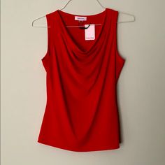 New With Tags Women’s Red Cowl-Necked Tank. Looks Great Paired With A Suit, Or As A Standalone Sleeveless Blouse For An Evening Out. Thanks For Looking! Casual Red Calvin Klein Tops, Calvin Klein Fitted Tank Top For Summer, Calvin Klein Fitted Summer Tank Top, Calvin Klein Summer Tank Top, Elegant Red V-neck Tank Top, Calvin Klein Sleeveless Spring Tops, Calvin Klein Fitted Sleeveless Tank Top, Calvin Klein Solid Tops For Summer, Elegant Calvin Klein V-neck Tops