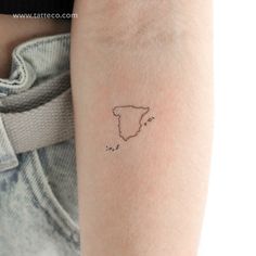 a woman's arm with a small tattoo of the state of south carolina on it