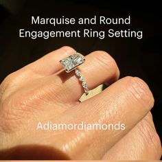 a woman's hand holding a diamond ring with the words marriage and round engagement ring setting