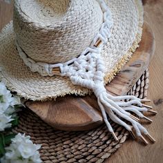 Enhance your favourite hat with our stunning Boho Hat Band, handcrafted with love and care. Made from a premium organic cotton cord, this hat decoration is designed to bring a touch of coastal charm and bohemian flair to any hat, but it's especially perfect for straw hats. The golden accents add a touch of elegance and create a delightful contrast against the natural fibres. FEATURES: - Material: Our hat band is meticulously crafted from the organic cotton cord, ensuring a soft and comfortable feel while being environmentally friendly. - Size: The inside circumference of the hat band is approximately 57cm, making it suitable for most hat sizes, but IF YOU NEED  CUSTOM SIZE JUST LET ME KNOW :) - Beach and Boho Look: Embrace the carefree spirit of the beach and the bohemian aesthetic with th Macrame Hat Band, Macrame Hat, Hat Decoration, Boho Hat, Bohemian Aesthetic, Coastal Charm, Boho Aesthetic, Straw Hats, Natural Fibres