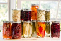 many jars filled with different types of food