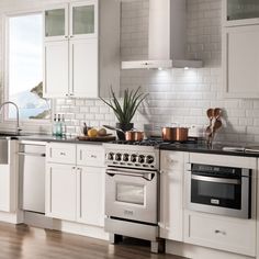 a kitchen with white cabinets and stainless steel appliances, is featured in an ad for rh stores