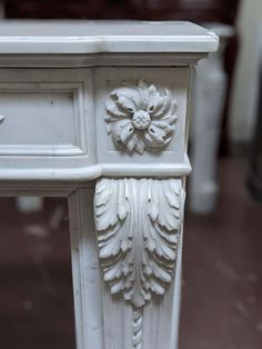 a white table with an ornate design on it