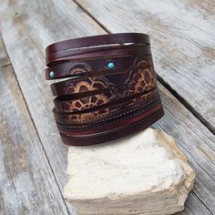 "Made from top quality Italian vegetable tanned leather. Hand dyed and embossed wirh genuine turquoise cabochons. Cuff is 1,8 inches (4,8 cm) wide Closure with screw button, so after purchase I need a wrist size! Please measure carefully your wrist and select the most preferable size! If you need a diferent size, please let me know after purchase in \"note for seller\". Please visit to my another shop: https://www.etsy.com/shop/JeansBelt?ref=hdr_shop_menu FEDEX to USA! If you need a faster shipp Vintage Hand Tooled Cuff Bracelet For Festivals, Vintage Hand-tooled Cuff Bracelet For Festivals, Brown Bohemian Leather Bracelet With Concho, Southwestern Brown Leather Bracelet For Festivals, Leather Cuff Bracelet For Festivals, Turquoise Leather Bohemian Cuff Bracelet, Bohemian Stamped Leather Bracelet, Bohemian Turquoise Leather Cuff Bracelet, Bohemian Stamped Cuff Bracelet