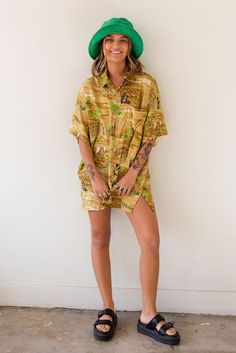 Vintage x Resurrection Hawaiiana Oversized Button Shirt features a retro Hawaiian design with button down front and chest pocket. Color: Gold/Green Multi Oversized Fit Short Sleeve Silk Brand: Creations Mens Size Large There will be imperfections and flaws that make this jacket unique in character with no two alike. There are some minor tears. These are not defects and simply lend to the character of this extra special piece. VINTAGE - FINAL SALE ITEM Retro Collared Hawaiian Shirt With Relaxed Fit, Retro Relaxed Fit Collared Hawaiian Shirt, Vintage Button-up Hawaiian Shirt For Summer, Retro Long Sleeve Beach Shirt, Retro Long Sleeve Shirt For Beach, Vintage Oversized Shirt With Pockets, Retro Spring Hawaiian Shirt With Relaxed Fit, Retro Hawaiian Shirt For Spring With Relaxed Fit, Retro Hawaiian Shirt For Spring