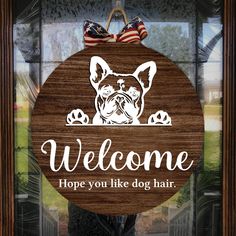 a wooden sign that says, welcome hope you like dog hair with an american flag on it