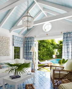 a living room filled with furniture and a pool