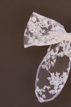 This cream sheer lace bow is the ultimate barrette for the effortlessly elegant. Its intricate floral lace design and sleek edges make it a must-have for all your hair updos. Plus, it clips in quickly and securely for a fuss-free finishing touch. Details: Weight: 1.9 oz (53.86 g) Clip in Style Elegant Lace Hair Accessories For Party, Elegant Lace Hair Accessories For Wedding, Bow Barrette, Pink Martini, A Beautiful Flower, Matt & Nat, Flower Lace, Lace Bows, Curvy Dress