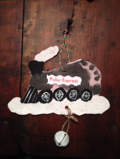 a wooden door decorated with an old fashioned train ornament