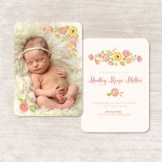 a baby is laying down on a blanket with the birth announcement card in front of it