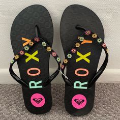 Roxy Flip Flop Sandals Women’s Size 7 Brand New Without Tag- Never Worn! Fun Black Flip Flops For Beach, Orange Synthetic Flip Flops, Fun Black Flip Flops For Vacation, Adjustable Multicolor Synthetic Flip Flops, Fun Black Flip Flops For Summer, Fun Black Sandals For Vacation, Fun Black Sandals For Summer, Fun Black Summer Sandals, Fun Black Synthetic Sandals