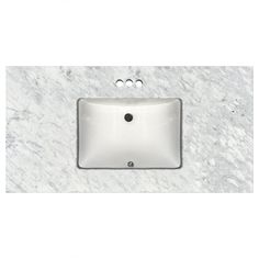 a white sink sitting on top of a marble counter