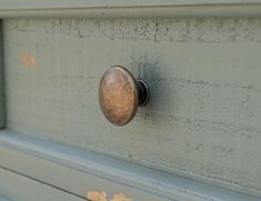 an old door knob is on the side of a building