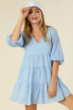 Gingham checked tiered dress- Description: This adorable dress features a yarn-dyed gingham check pattern, perfect for a playful and quirky look. With a flattering V-neck and cute puff sleeves, this dress is sure to turn heads. The 3/4 sleeve length and no stretch provide comfort, while the lining ensures there is no see-through. Model is 5'75" wearing size small Fabric Contents: 50% polyester 50% rayon Care instruction : hand wash cold, only non-chlorine bleach when needed, dry flat, cool iron Check Frock Designs For Women, Check Frock, Check Dresses For Women, Tiered Dress Pattern, Gingham Dresses, Little Black Dress Outfit, Sew Dress, Sewing Creations, Strapless Sundress