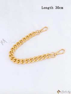 the gold chain is shown on a white background, and it has been cut in half