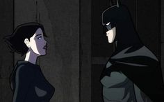 batman and catwoman standing next to each other in the dark knight animated film,