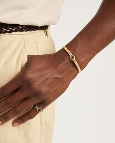 A Vibe signature, The Hook Bracelet is fashioned in gently hammered 14K solid gold with a 14K gold "C" hook clasp. Featuring a replica of the St. John petroglyph and seven 14K gold good luck wraps, solo or stacked, it is sure to be a favorite statement piece. Found in many of our designs, Vibe’s seven good luck wraps represent love, laughter, happiness, good fortune, health, unity, and peace. In the Caribbean tradition, wear your hook facing in to keep love close to your heart, and facing out if Gold Brass Bracelet With Lobster Clasp, Minimalist Gold-tone Bracelets With Lobster Clasp, Everyday Gold-tone Bracelet With Lobster Clasp, Classic Gold-plated Chain Bracelet With Lobster Clasp, Modern Gold-tone Bracelets With Lobster Clasp, Gold C, Hook Bracelet, Hook Clasp, Solid Gold